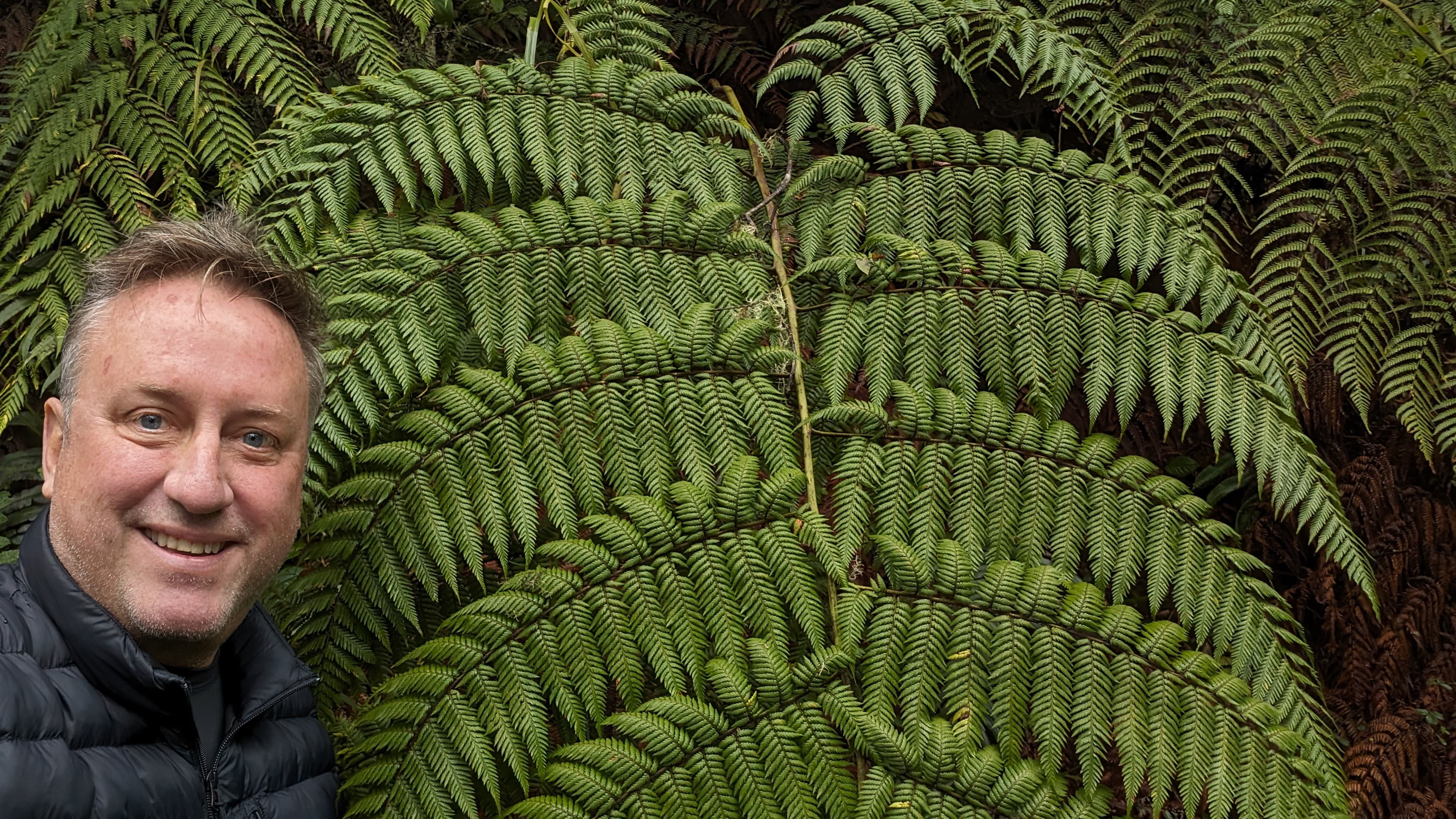 Rudy smiling with family